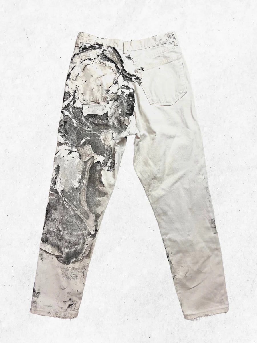 A pair of white pants with a black and white print.