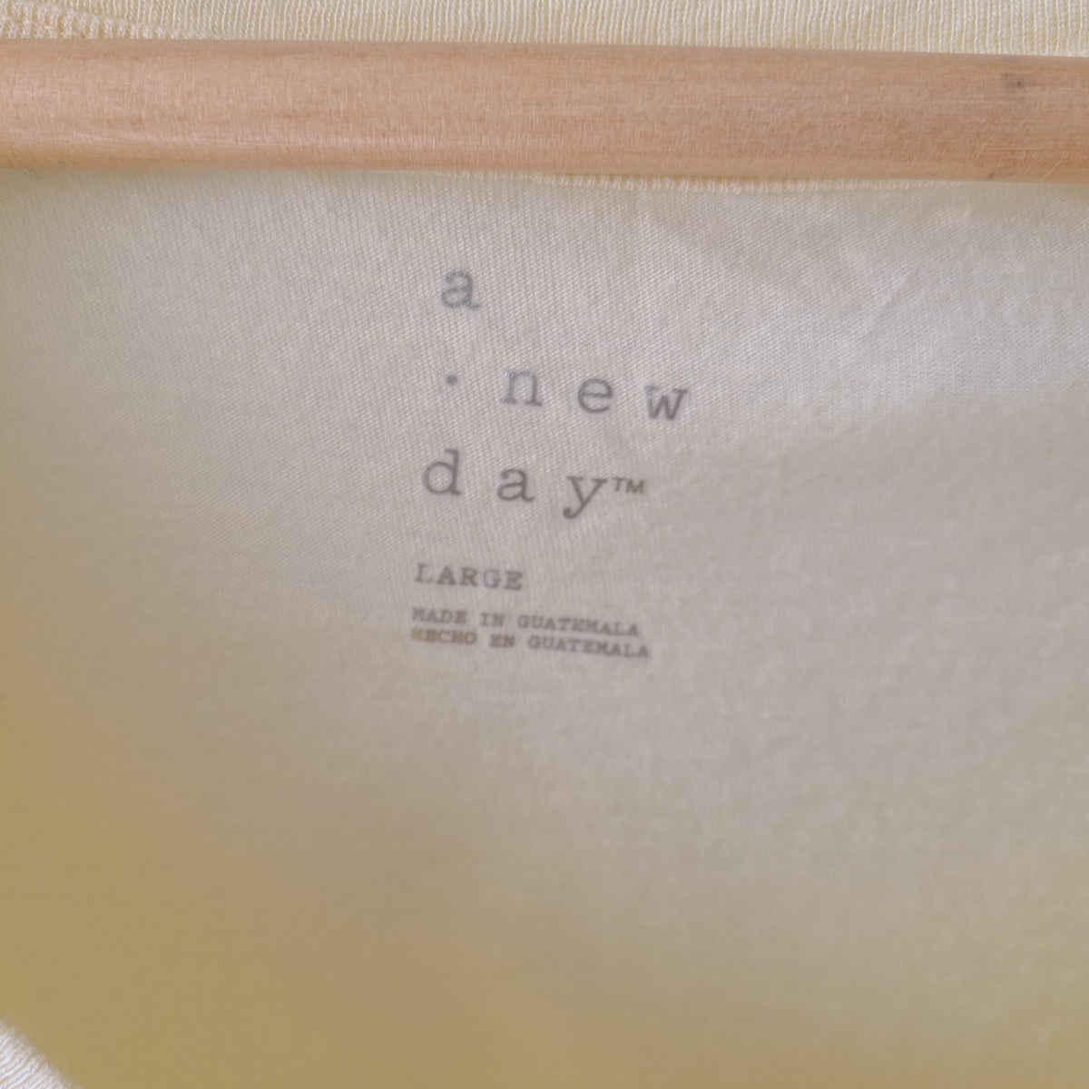 a close up of a piece of cloth with a wooden handle.