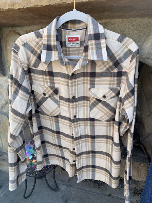 A Queen Music Rock Band Flannel Shirt hanging on a clothes rack.