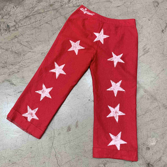 a pair of red pants with white stars on them.