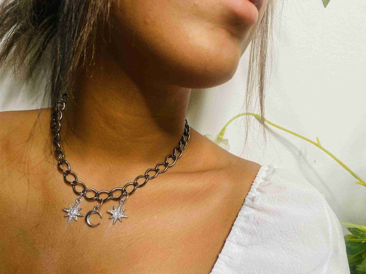a close up of a woman wearing a necklace.