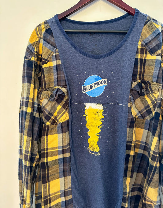 a women's blue moon t - shirt hanging on a hanger.