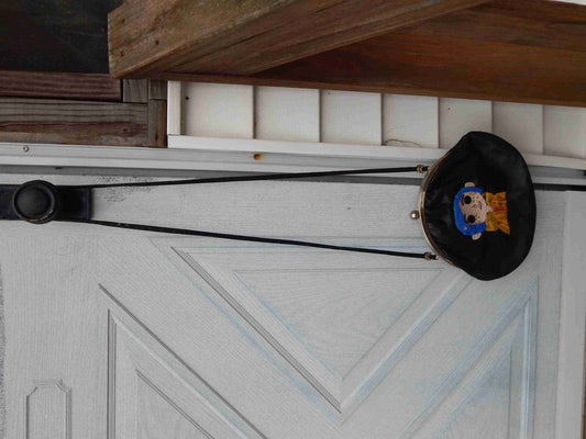 a hat hanging on the side of a door.