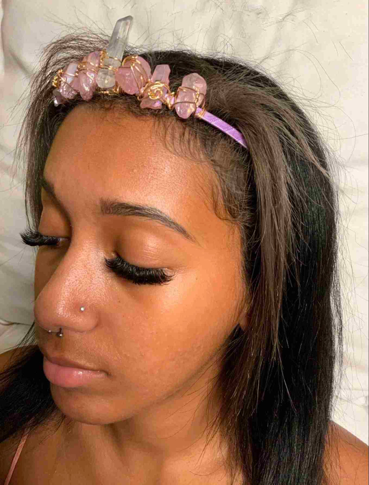 a woman with a flower crown on her head.