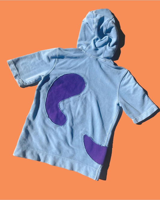 a blue hoodie with a purple question mark on it.