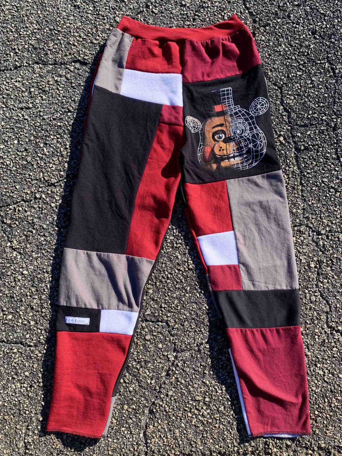 a pair of pants with a picture of a dog on it.