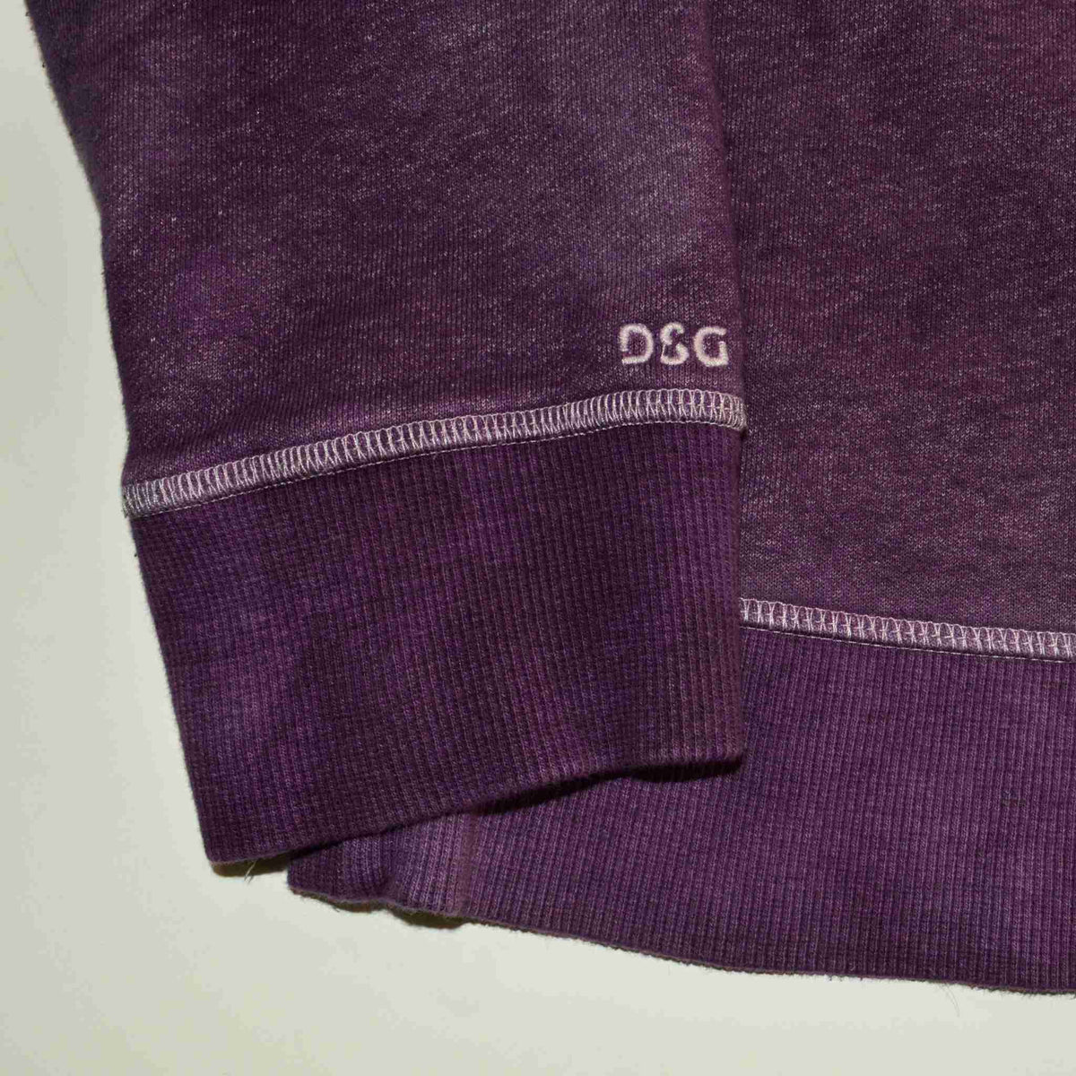 a close up of a pair of purple sweatpants.