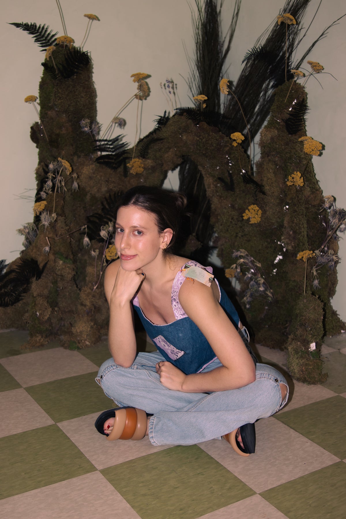 A woman sitting on an Upcycled Denim Crop Top, Vintage Purple Bandana Straps, S/M floor.