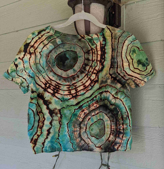 a t - shirt hanging on the side of a building.