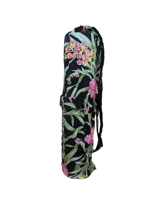 A black yoga bag with pink flowers on it.