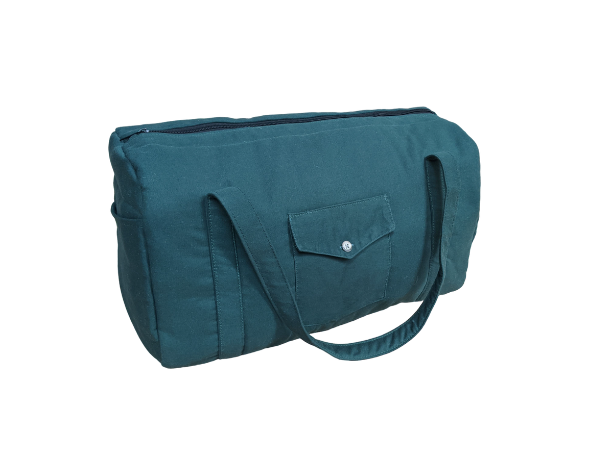 A teal tote bag on a black background.