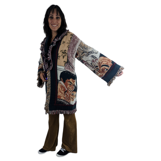 a woman wearing a colorful coat and brown pants.