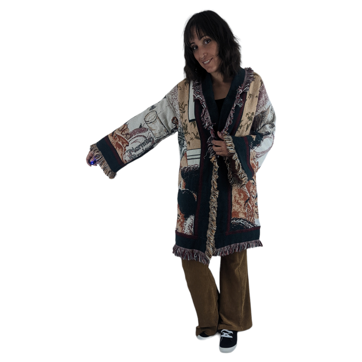 a woman in a long coat is posing for a picture.