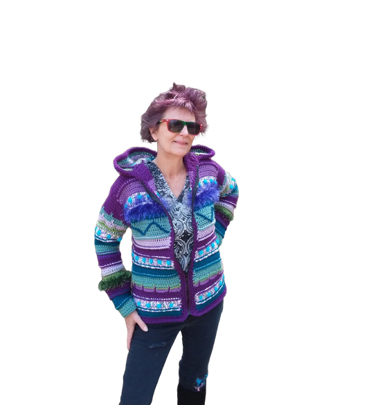 A purple, blue and green crochet cardigan sweater with hood