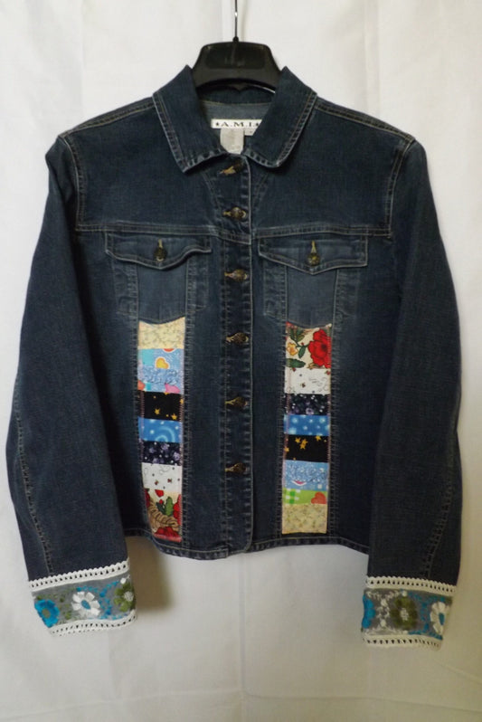 An upcycled denim jacket with patchwork front and lace cuffs