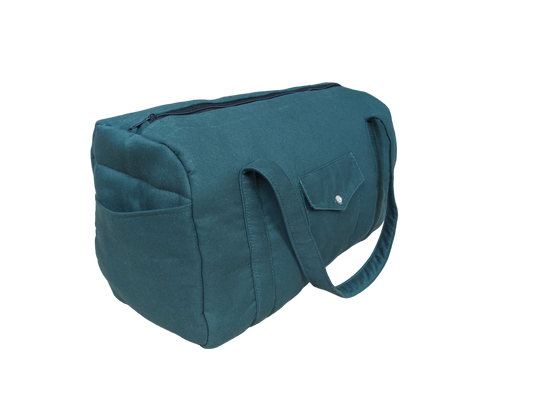 A teal bag on a black background.