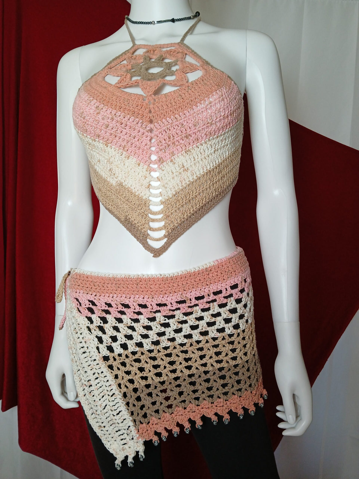 A handmade crocheted lotus flower halter top and beaded hip scarf skirt in ice cream shades.