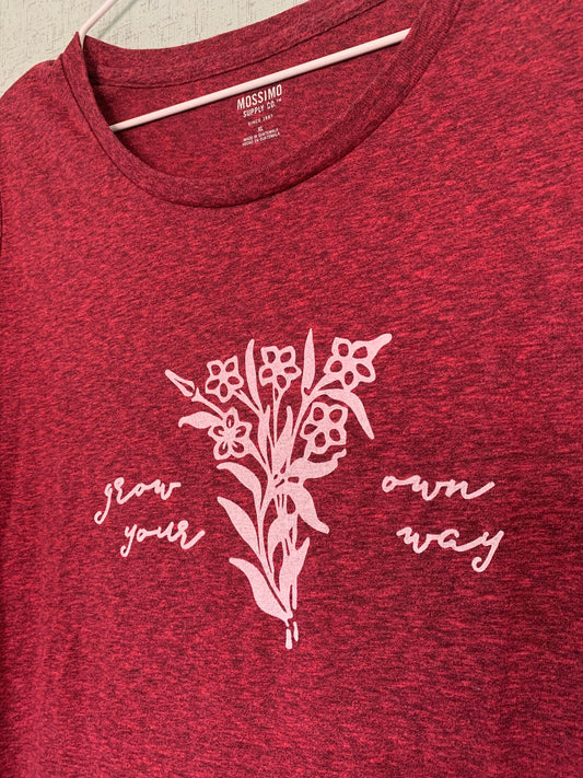 A red t - shirt with flowers on it.