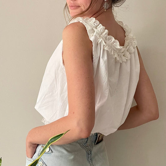 a woman with a flower in her hand.