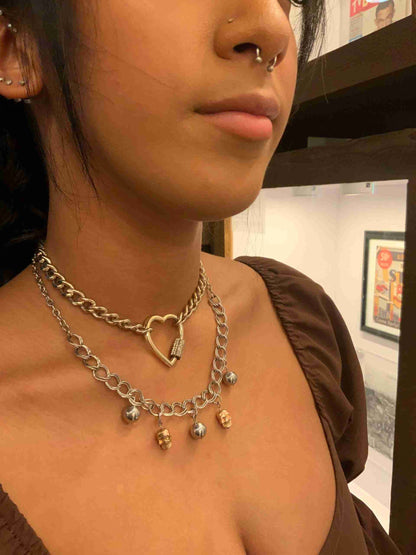 a close up of a person wearing a necklace.