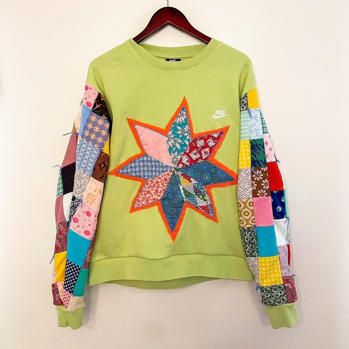nike patchwork star sweatshirt.