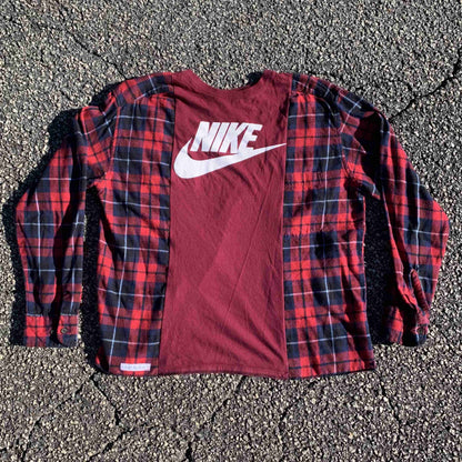 a red and black shirt with a white nike logo on it.