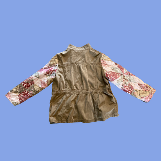 A girl's jacket with a floral pattern on it.