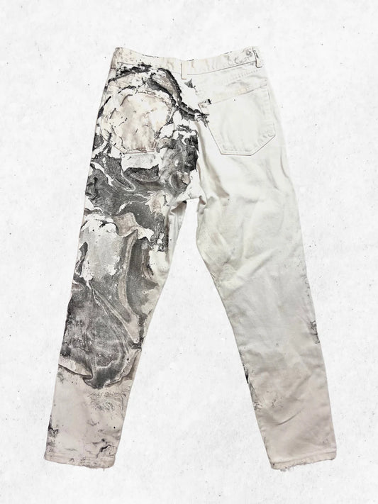 A pair of white pants with a black and white print.