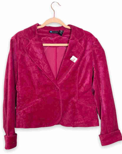 a pink jacket hanging on a hanger.