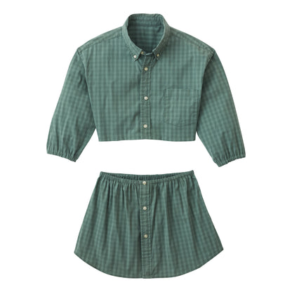 A woman wearing the Caterpillar Picnic (green and white checkered two-piece set).