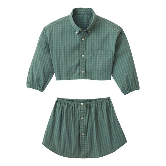 A woman wearing the Caterpillar Picnic (green and white checkered two-piece set).