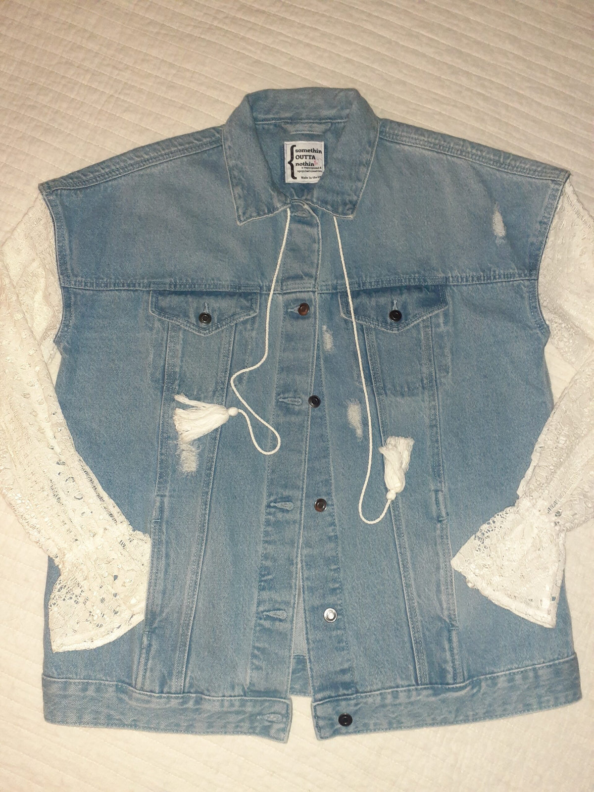Take Me To The Ocean upcycled denim & lace jacket with lace sleeves and a lace sleeve.
