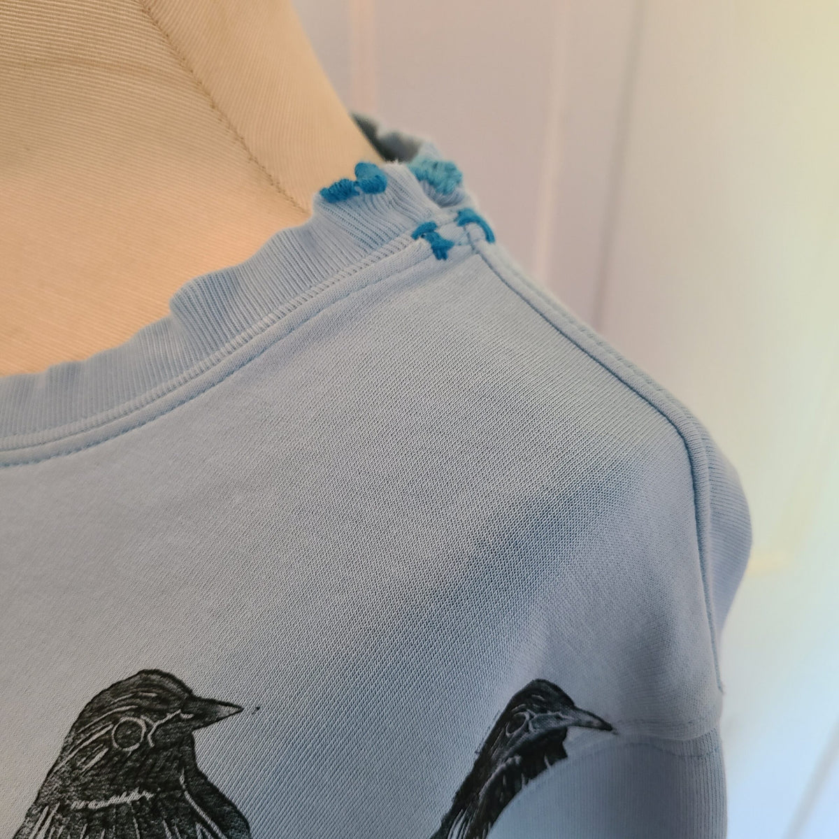 Blue Sweatshirt with Bird Print and Visible Mends
