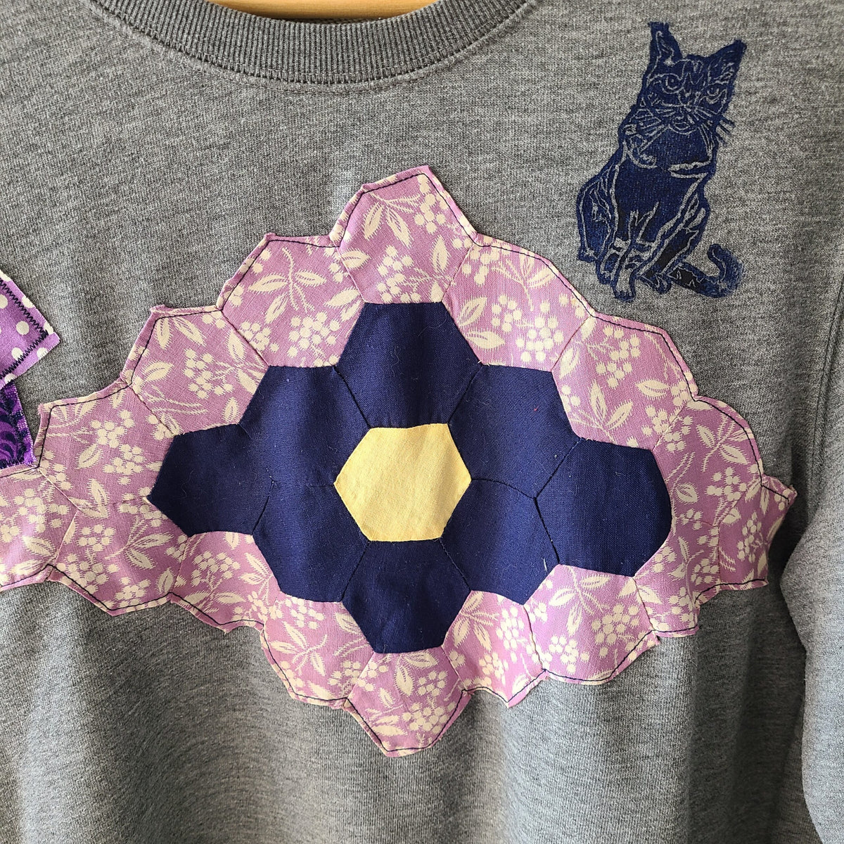 a t - shirt with a cat on the back of it.
