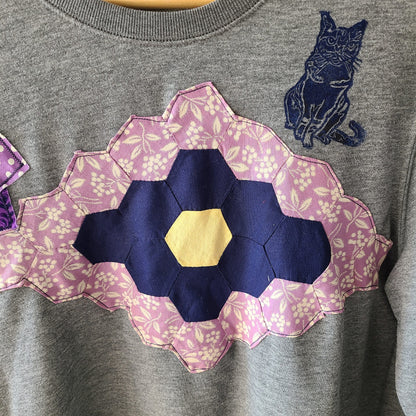 a t - shirt with a cat on the back of it.