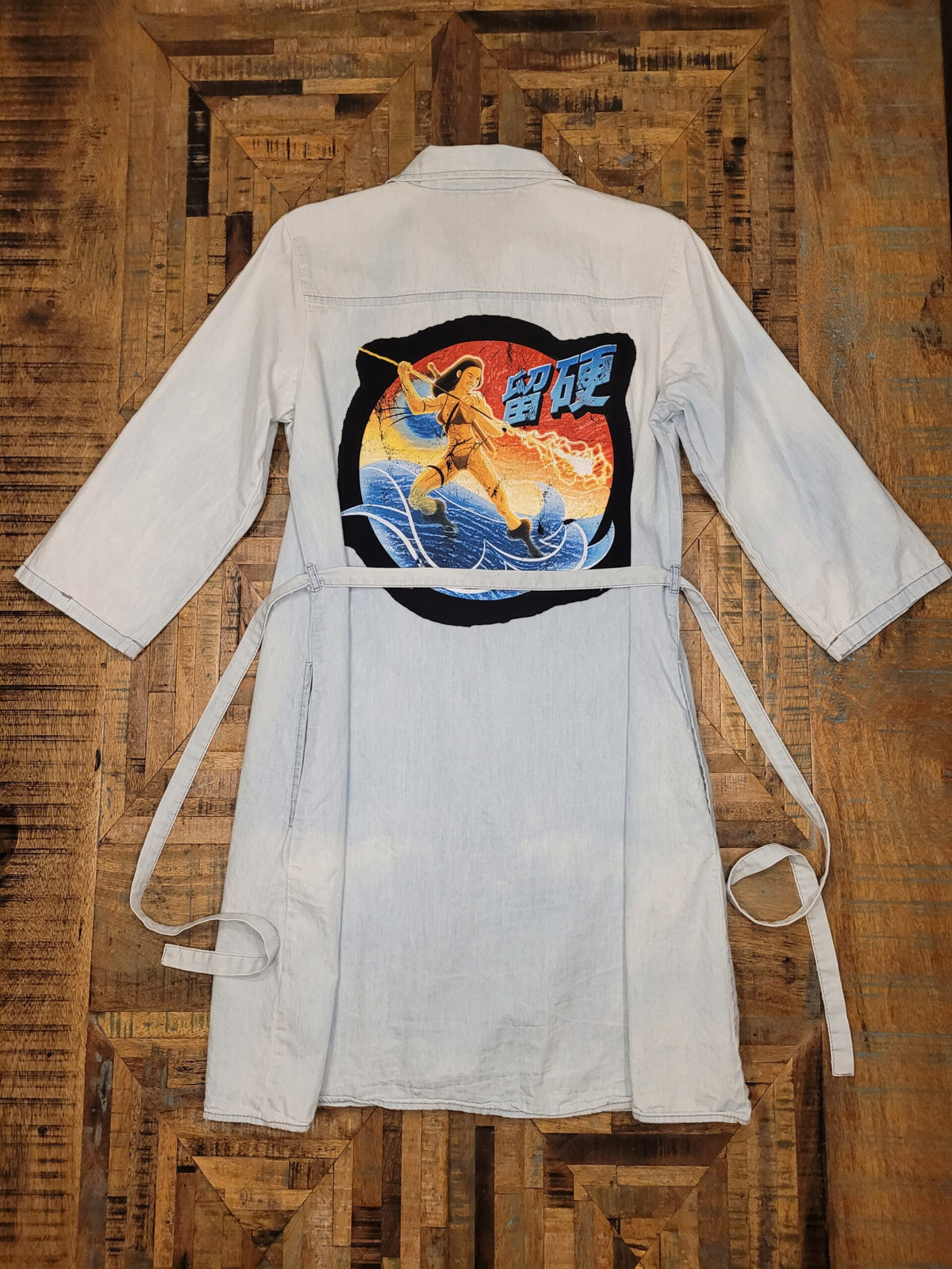 a white shirt with a picture of a horse on it.