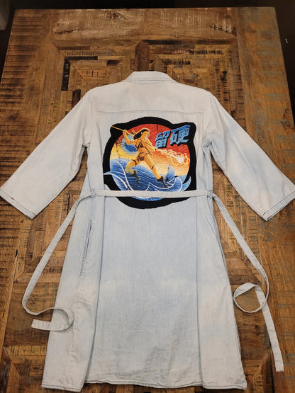 a white shirt with a picture of a horse on it.