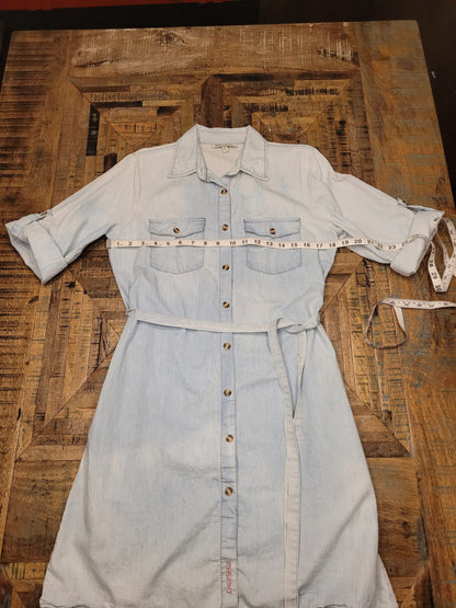 a denim shirt with a measuring tape on it.
