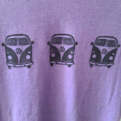 a purple t - shirt with three vw vans on it.