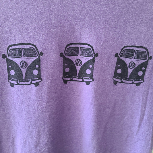 a purple t - shirt with three vw vans on it.