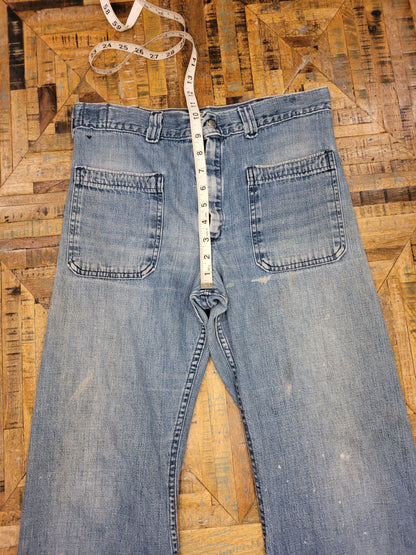 a pair of jeans with a tape measure on it.