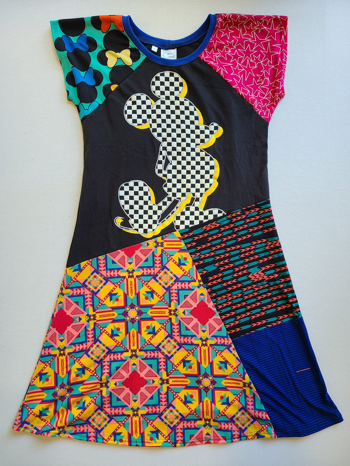 A dress with a mickey mouse on it.