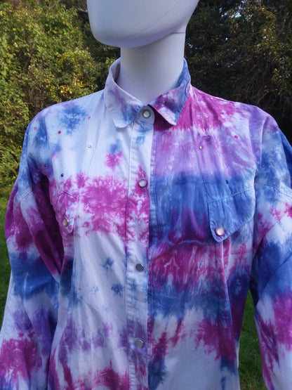 A Tie dye dress with pearl snaps and rhinestone accents