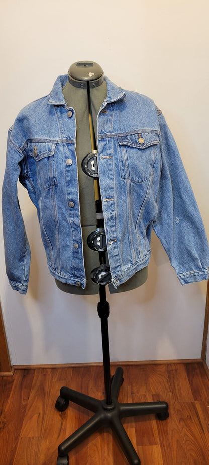 A denim jacket on a mannequin.