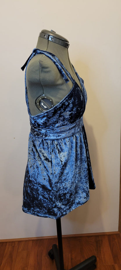 A mannequin wearing a blue dress.