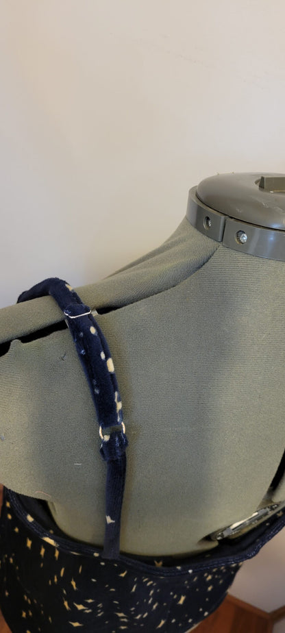 A blue and white fabric on a mannequin.