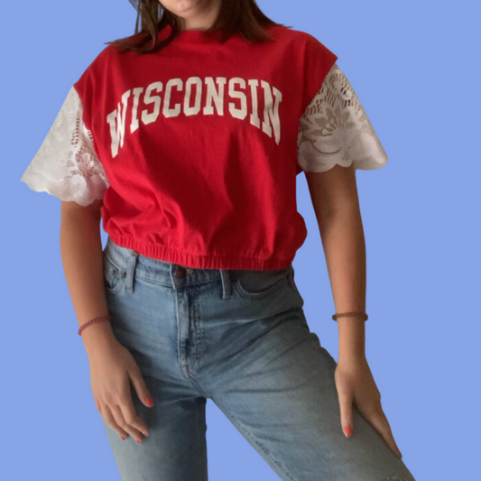 A woman wearing a wisconsin t - shirt.