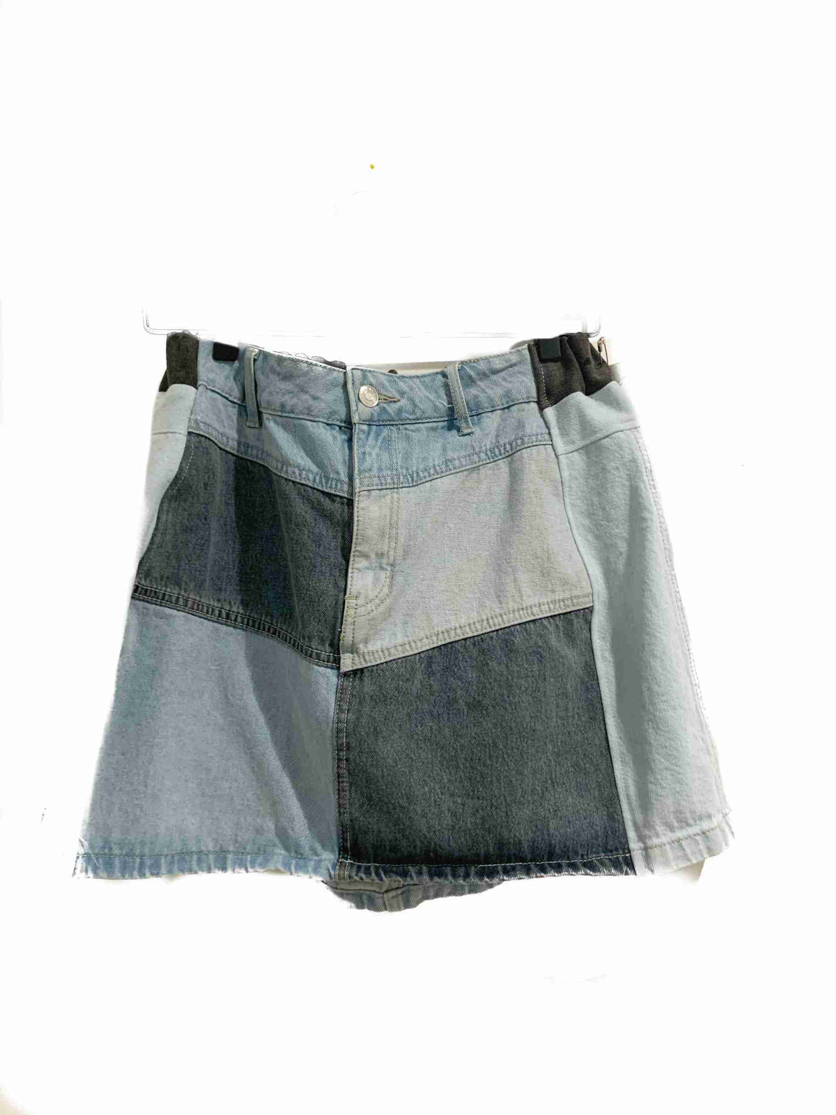 a pair of shorts hanging on a clothes line.