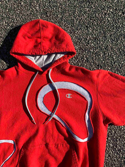 a red sweatshirt with a white logo on it.