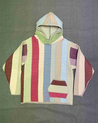 a striped shirt with a hoodie on top of it.